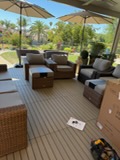 Modern covered patio with comfortable seating, wooden deck, and scenic outdoor views